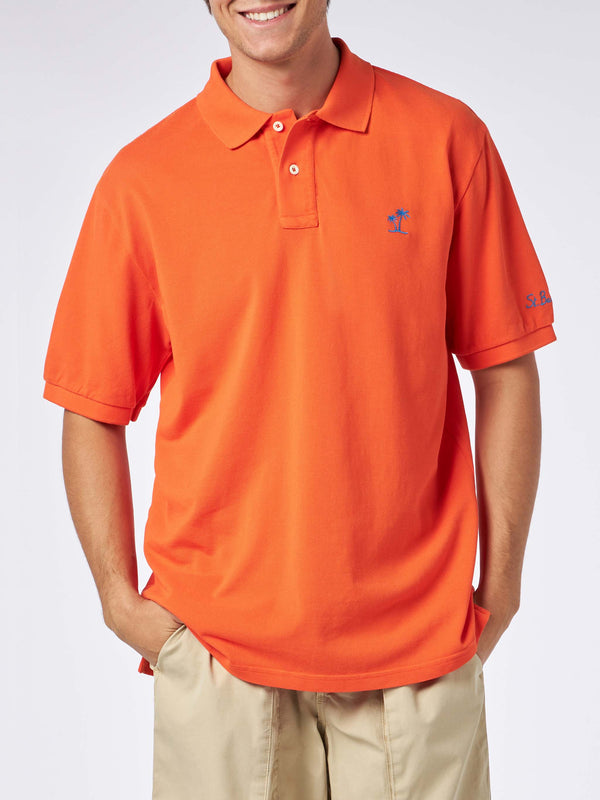 Man orange piquet polo with St. Barth logo and vintage effect