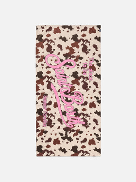 Aidan beach towel with cow print and logo