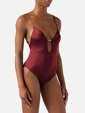 Crunchy one-piece swimsuit in burgundy glossy finish with charms