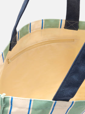 Essential canvas tote bag with green, light blue and white stripes and contrasting logo