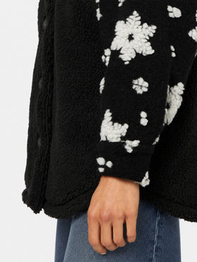 Giacca Elys in sherpa nera con fantasia fiocchi di neve