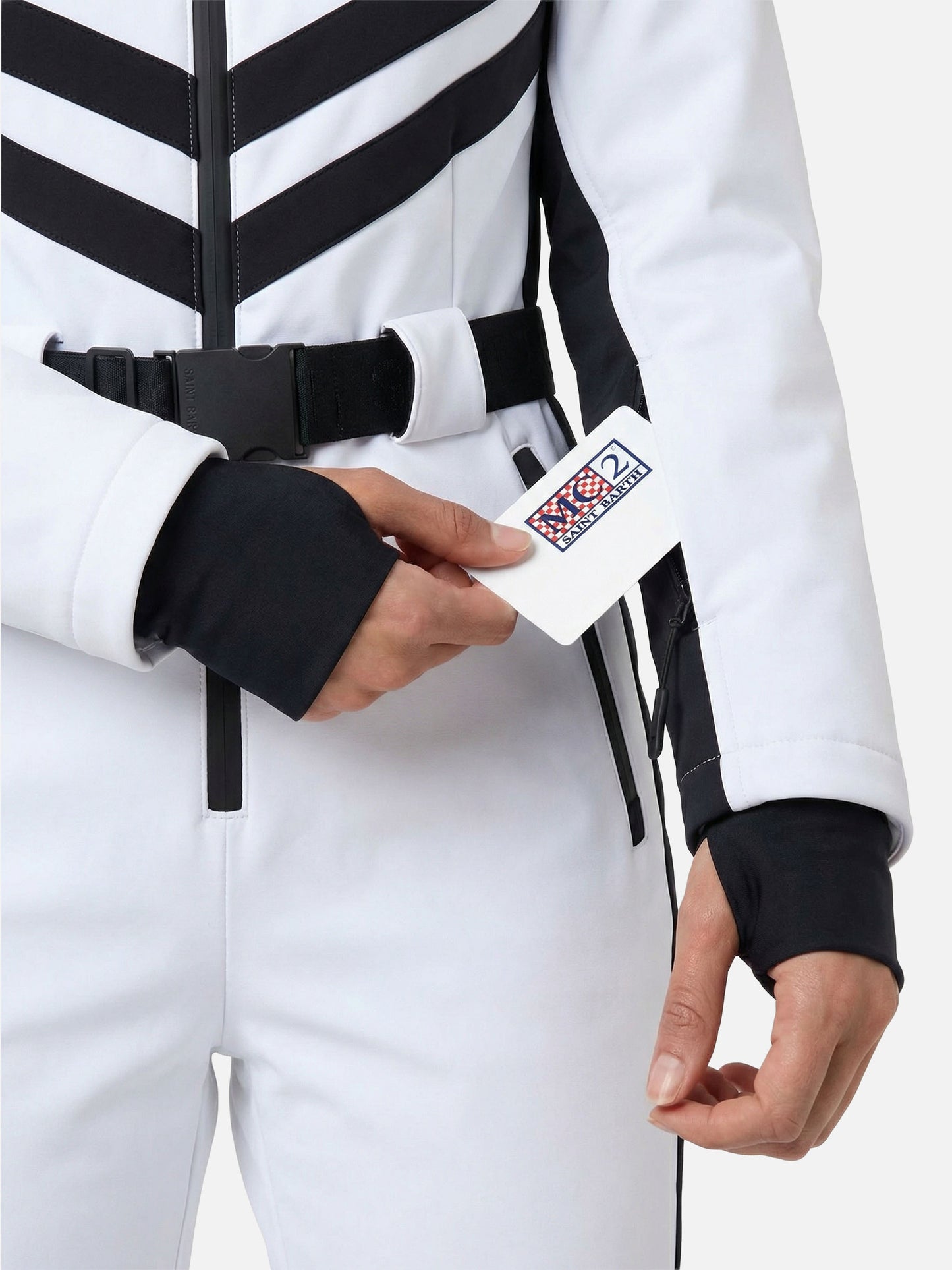 Woman white ski suit Garmisch with RECCO® technology