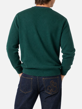 Dark green Heron sweater with New York apple jacquard