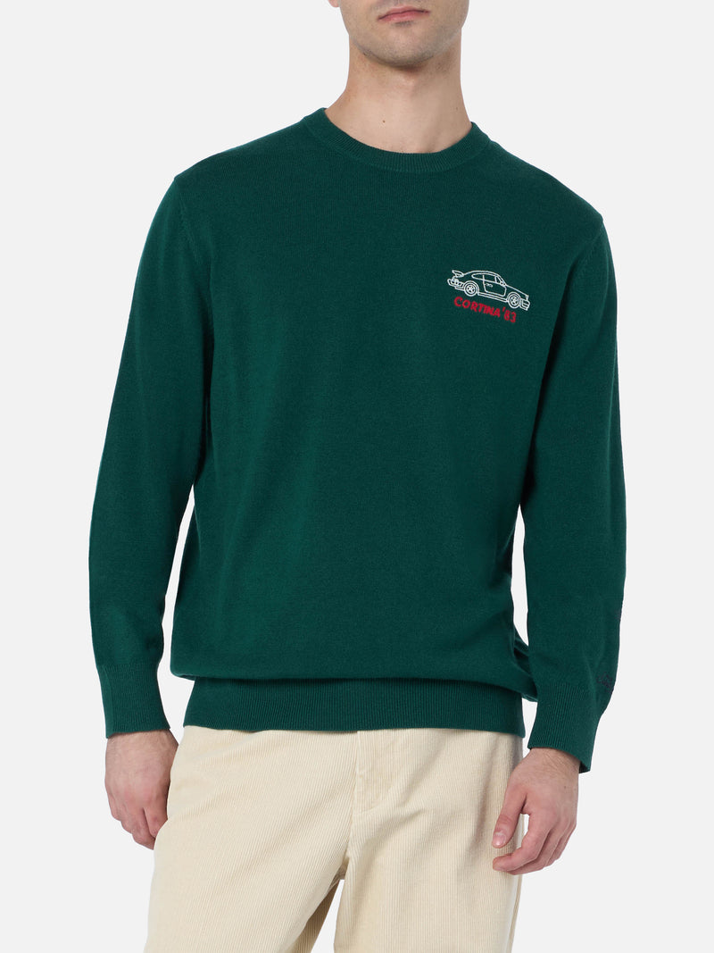 Man green sweater Heron with Cortina'83 speed embroidery