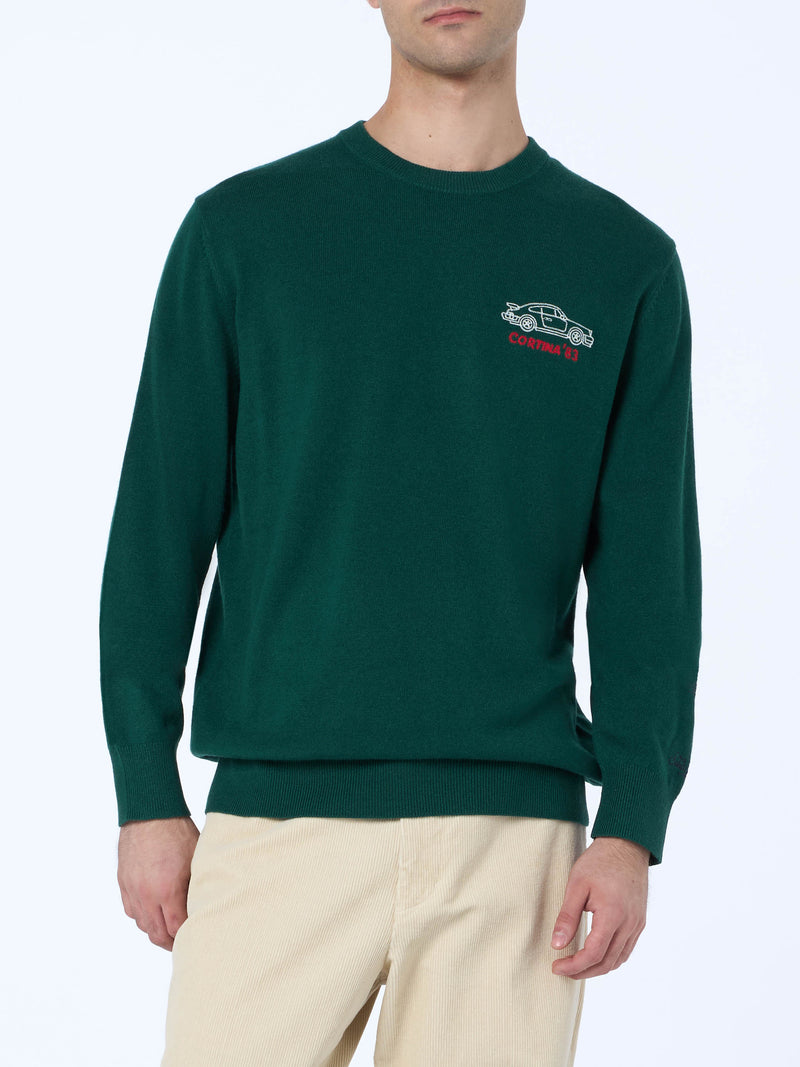 Man green sweater Heron with Cortina'83 speed embroidery