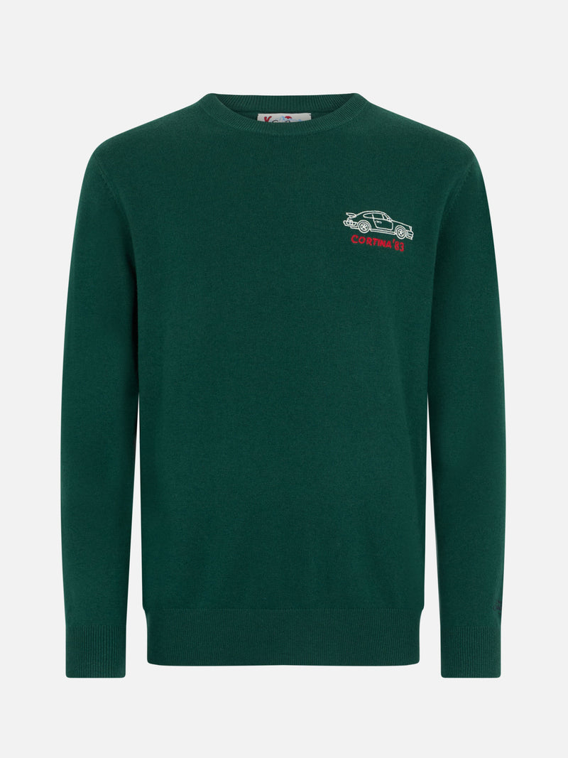 Man green sweater Heron with Cortina'83 speed embroidery