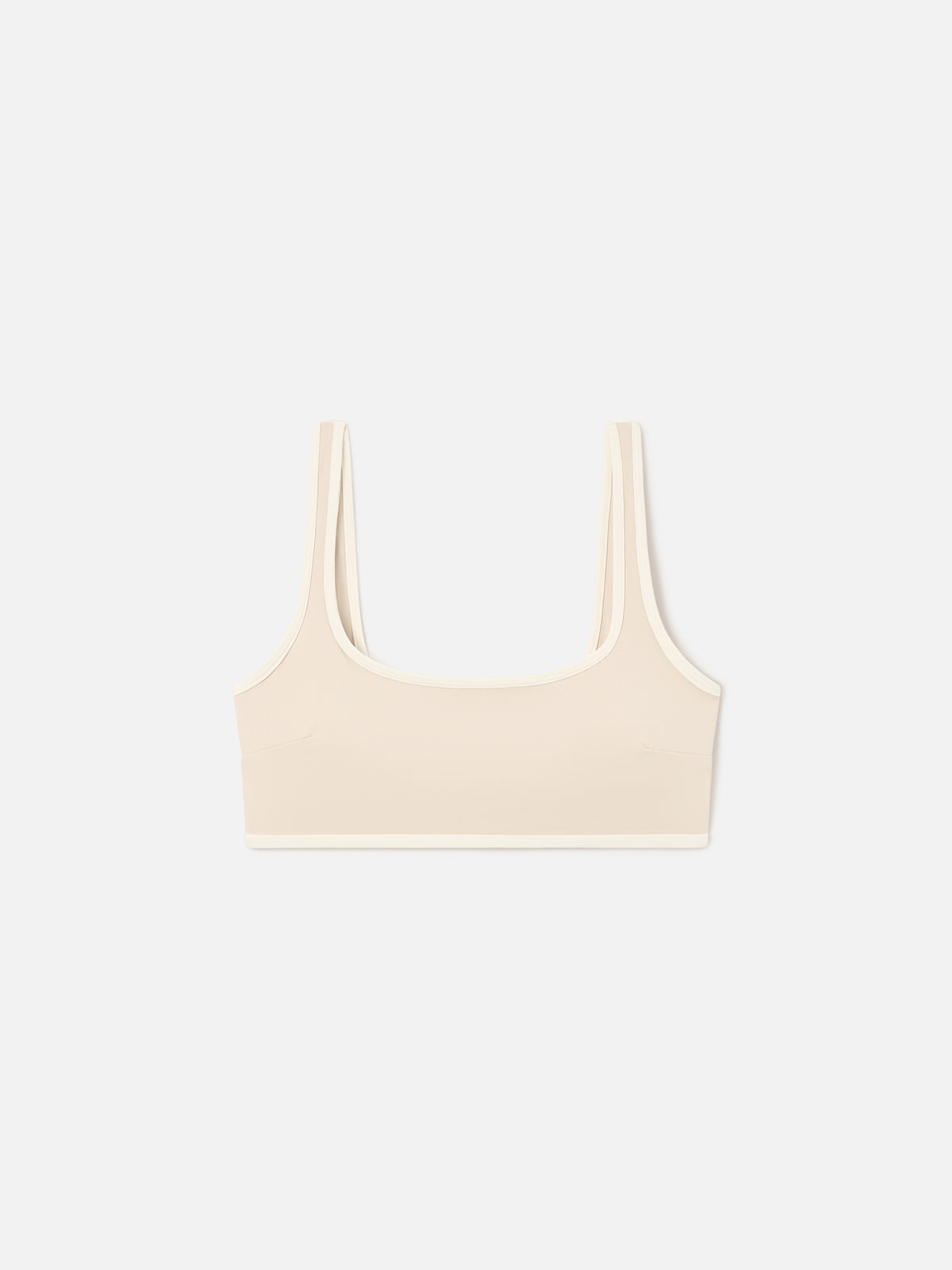 Top fitness Kassie beige con ribetes en contraste 