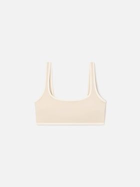 Top fitness Kassie beige con ribetes en contraste 