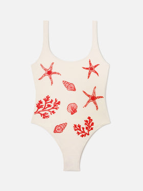 Bañador de una pieza Lora en color crema con decoraciones de cuentas de temática marina 