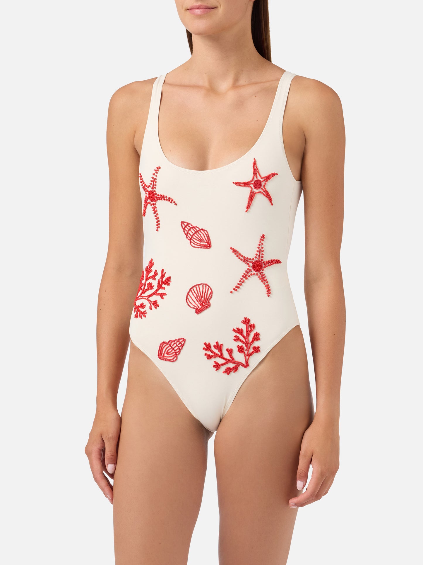 Bañador de una pieza Lora en color crema con decoraciones de cuentas de temática marina 