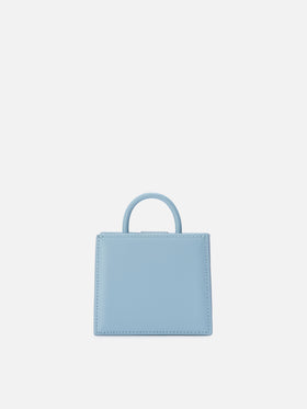 Structured Shop micro bag in light blue smooth leather with metal tag