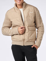 Man beige padded jacket with knitted braided sleeves