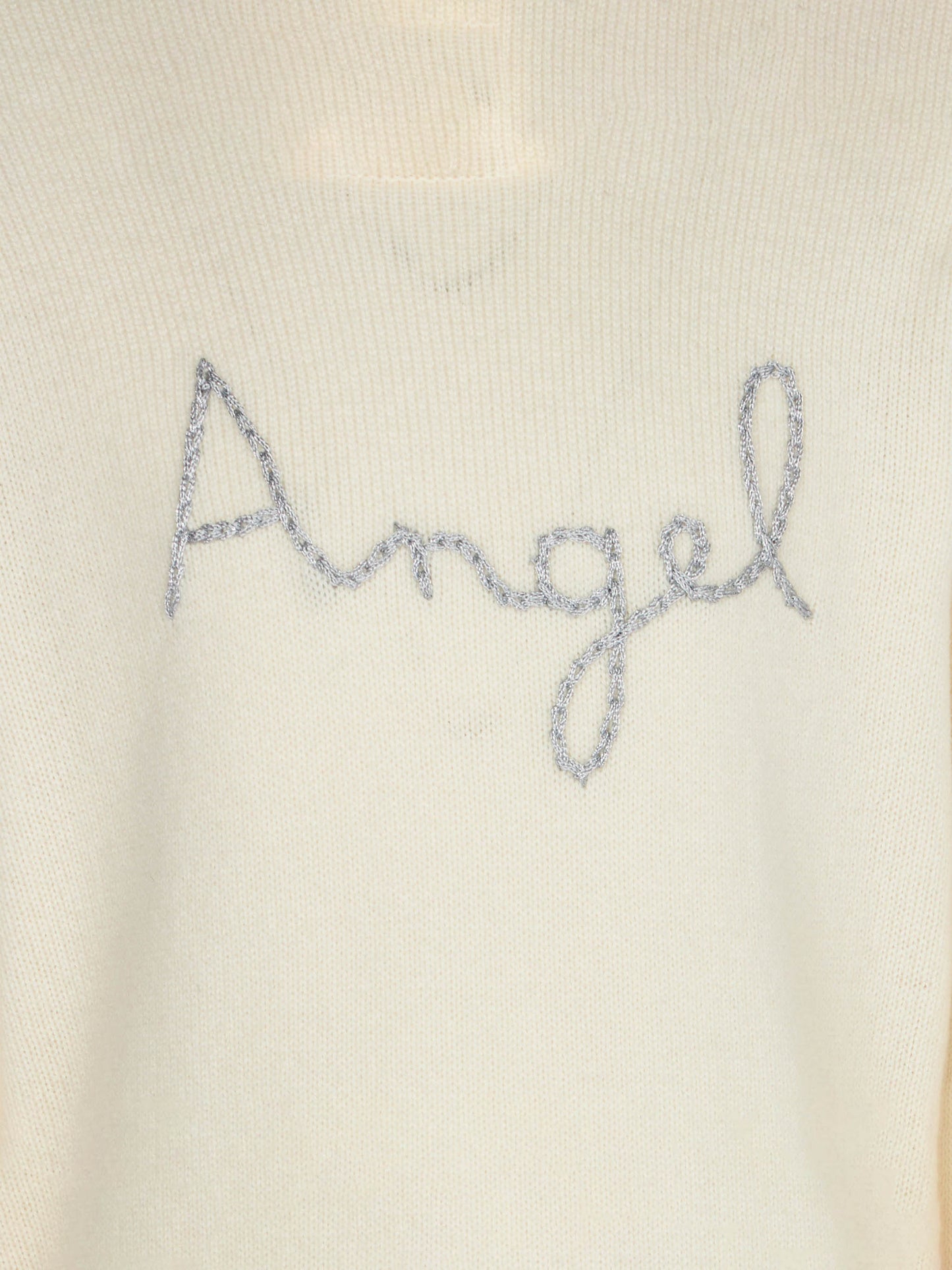 Girl white sweater angel wings embroidery