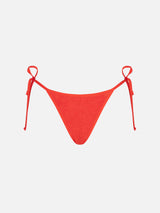 Woman orange crinkle cheeky swim briefs