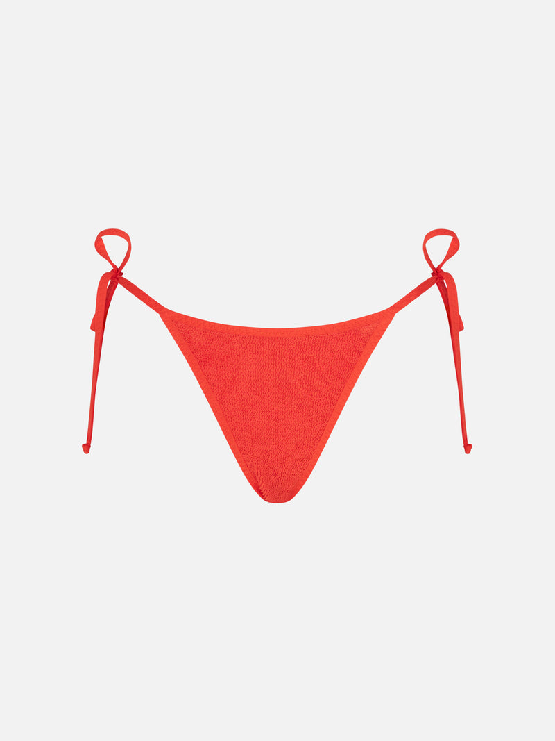 Woman orange crinkle cheeky swim briefs