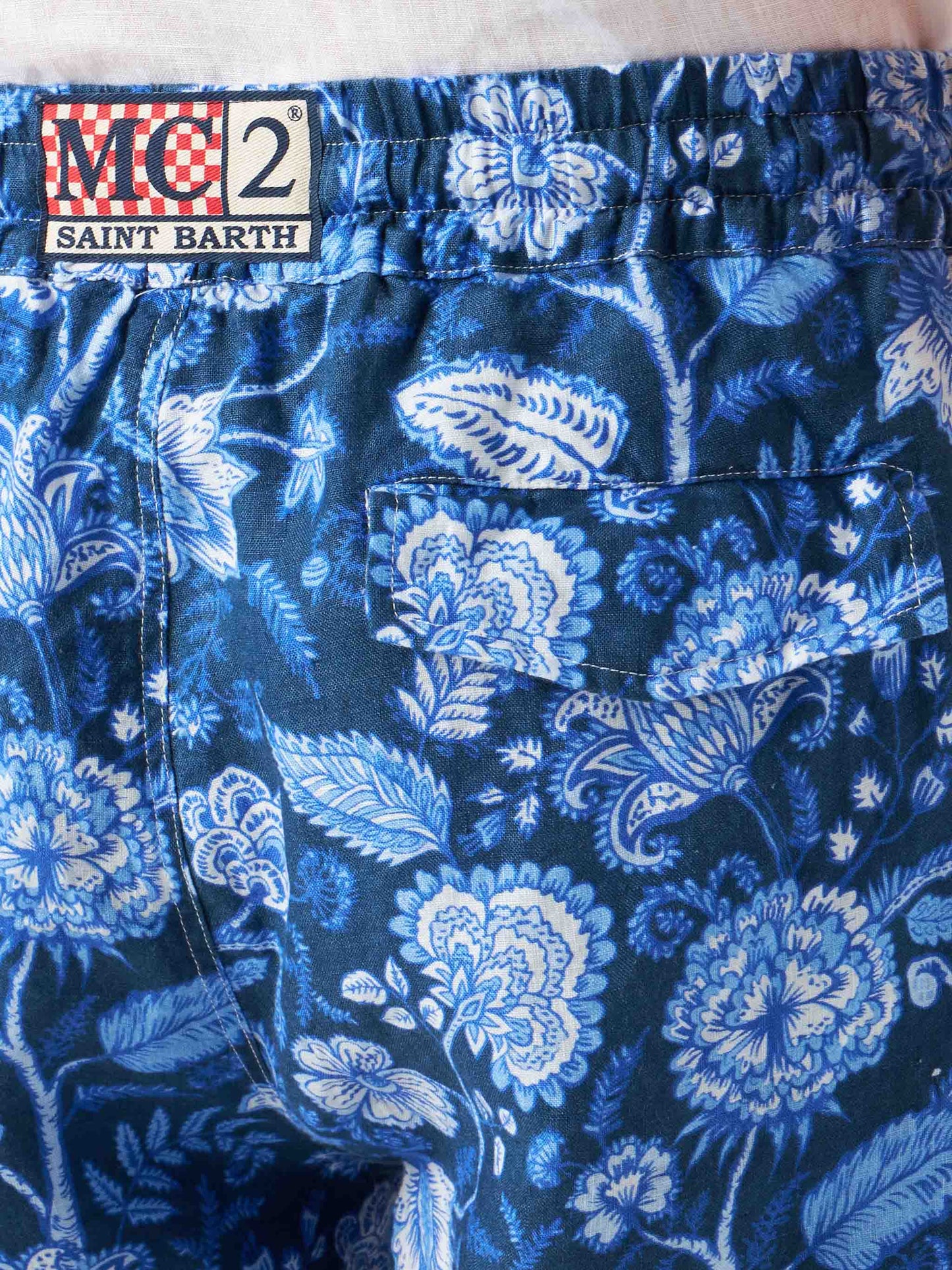 Man linen blue bermuda shorts with flower print