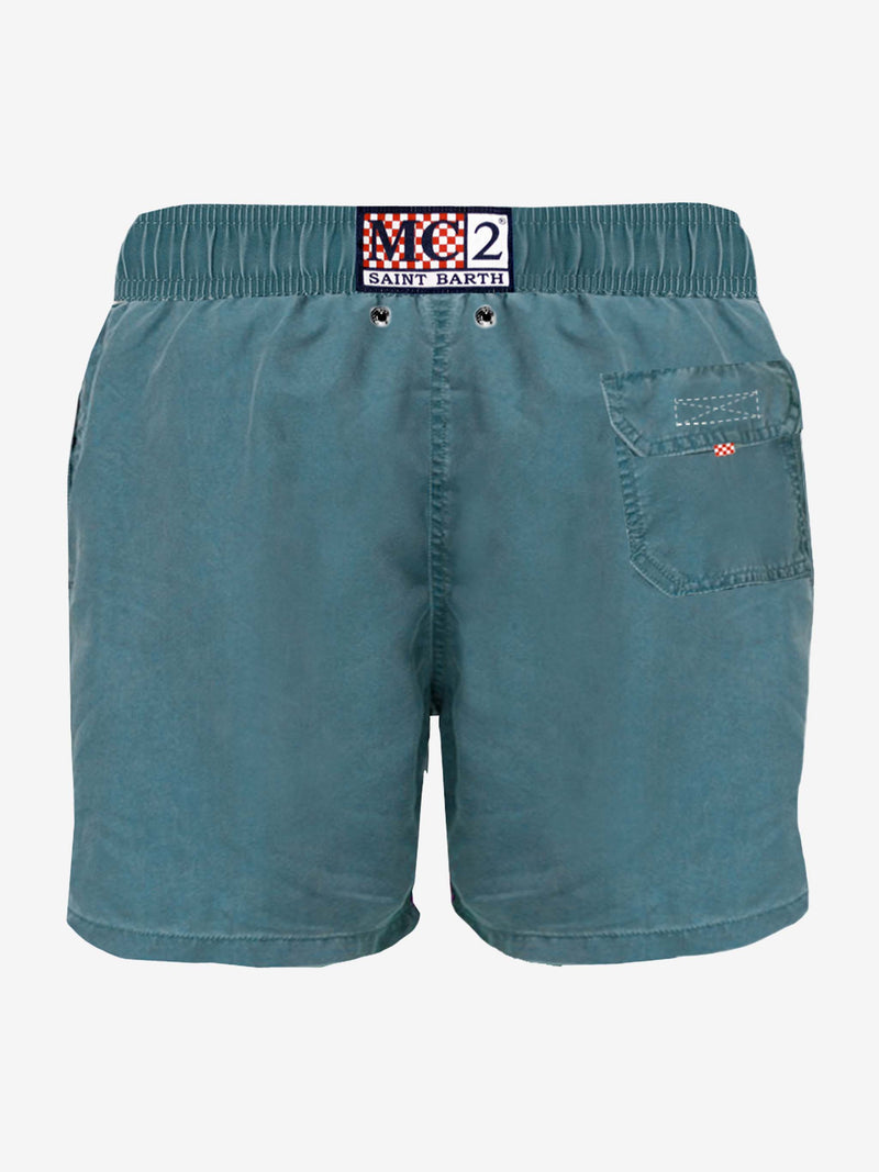 Man teal swim shorts