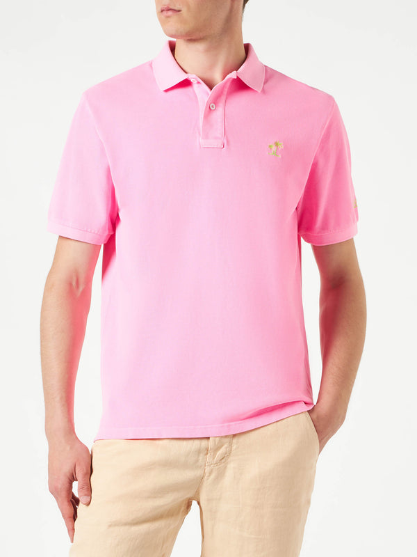 Polo in piquet rosa con logo St. Barth ed effetto vintage