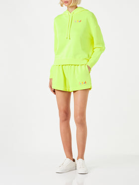 Pantaloncini corti da donna in cotone giallo fluo