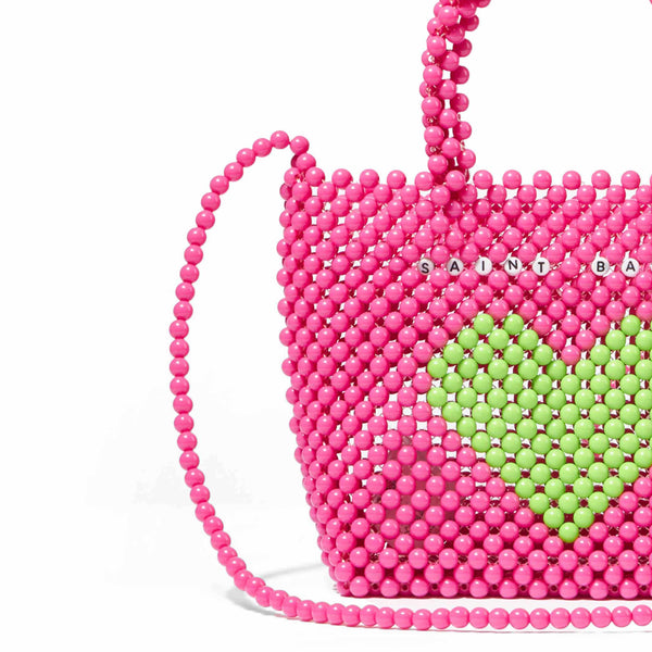 Beaded pink handbag with green heart