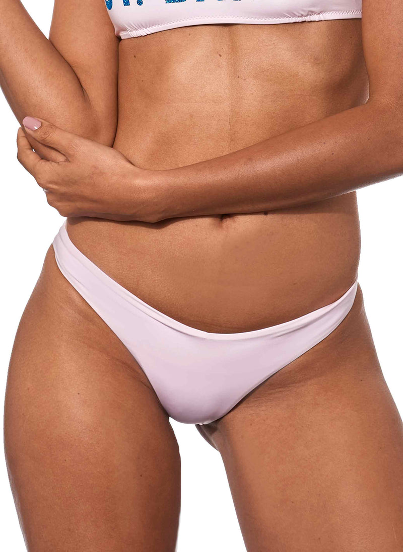 Woman pink cheeky swim briefs