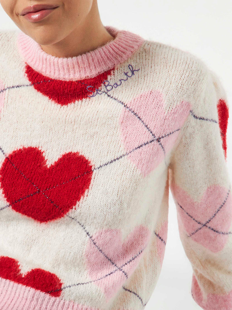 Woman brushed striped sweater with heart pattern